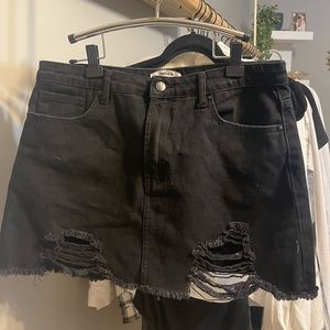 Black distressed denim skirt